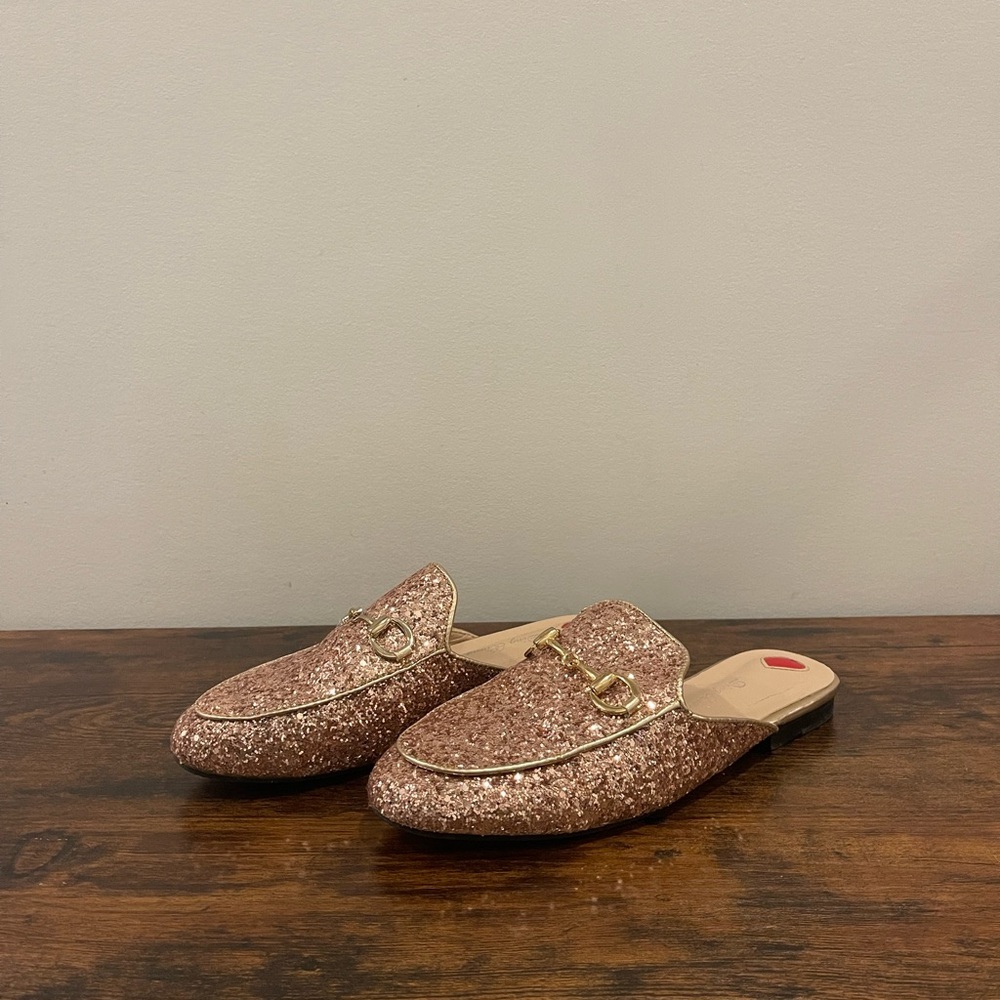 Rose gold glitter slide mules with horsebit buckle